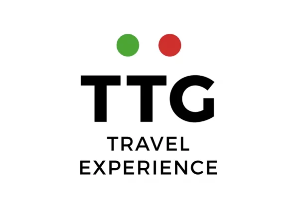 Logo "TTG Travel Experience" con punti verde e rosso.